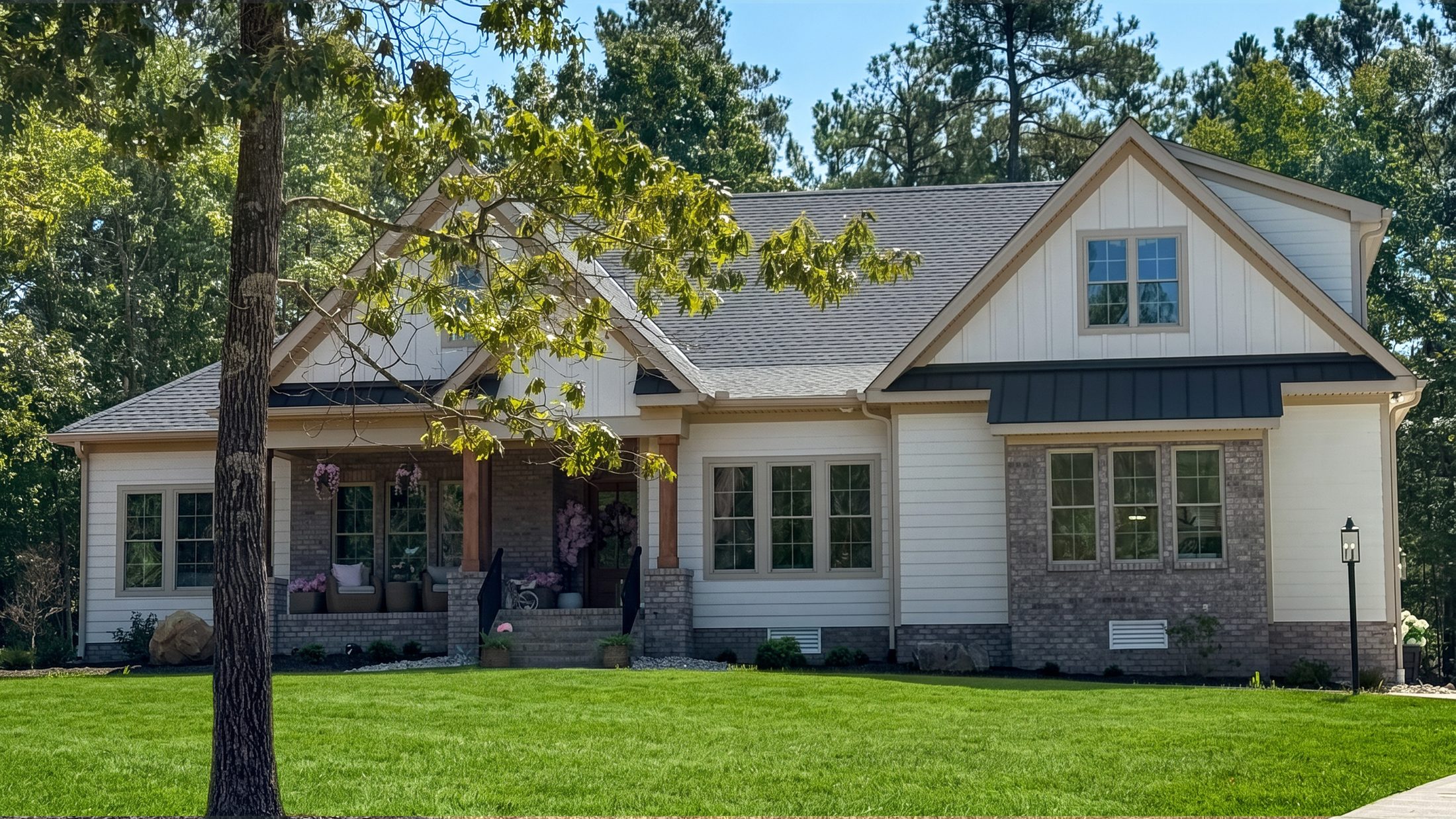 The Cherrywood — a white and stone craftsman set among pines