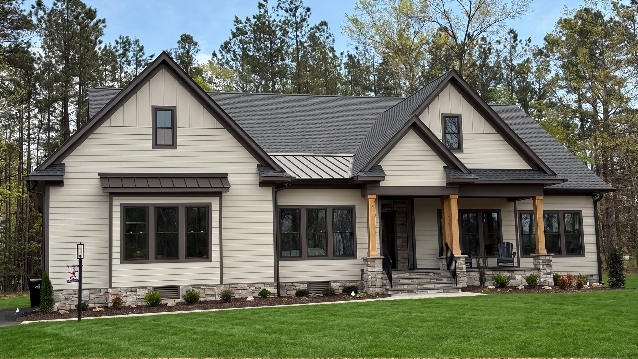 The Seneca Rock — a cream craftsman with a stone porch and timber posts